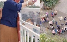 Bagi-bagi Rezeki, Wanita Ini Sawer Duit Rp100 Juta dari Balkon Rumahnya